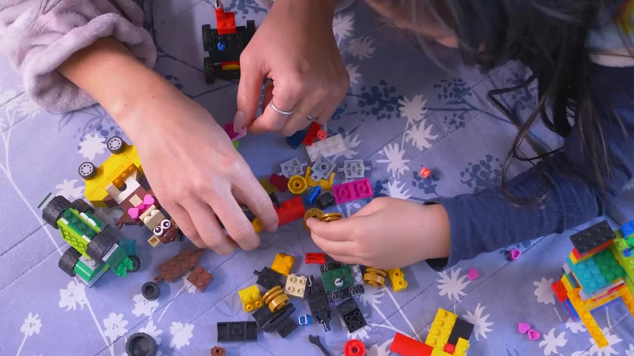 Stock Video Mother And Her Daughter Playing With Lego Piece Animated Wallpaper - Free Download