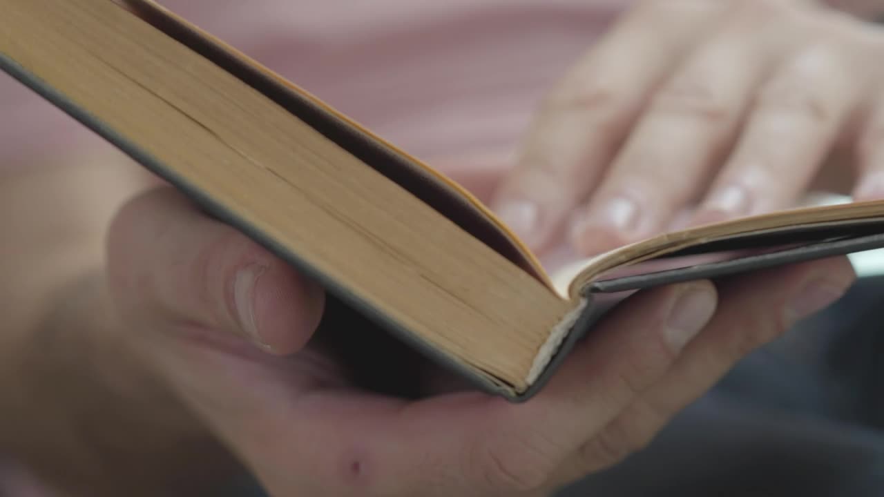Stock Video Person Flipping Through A Book Looking For A Page Live Wallpaper - Free Download