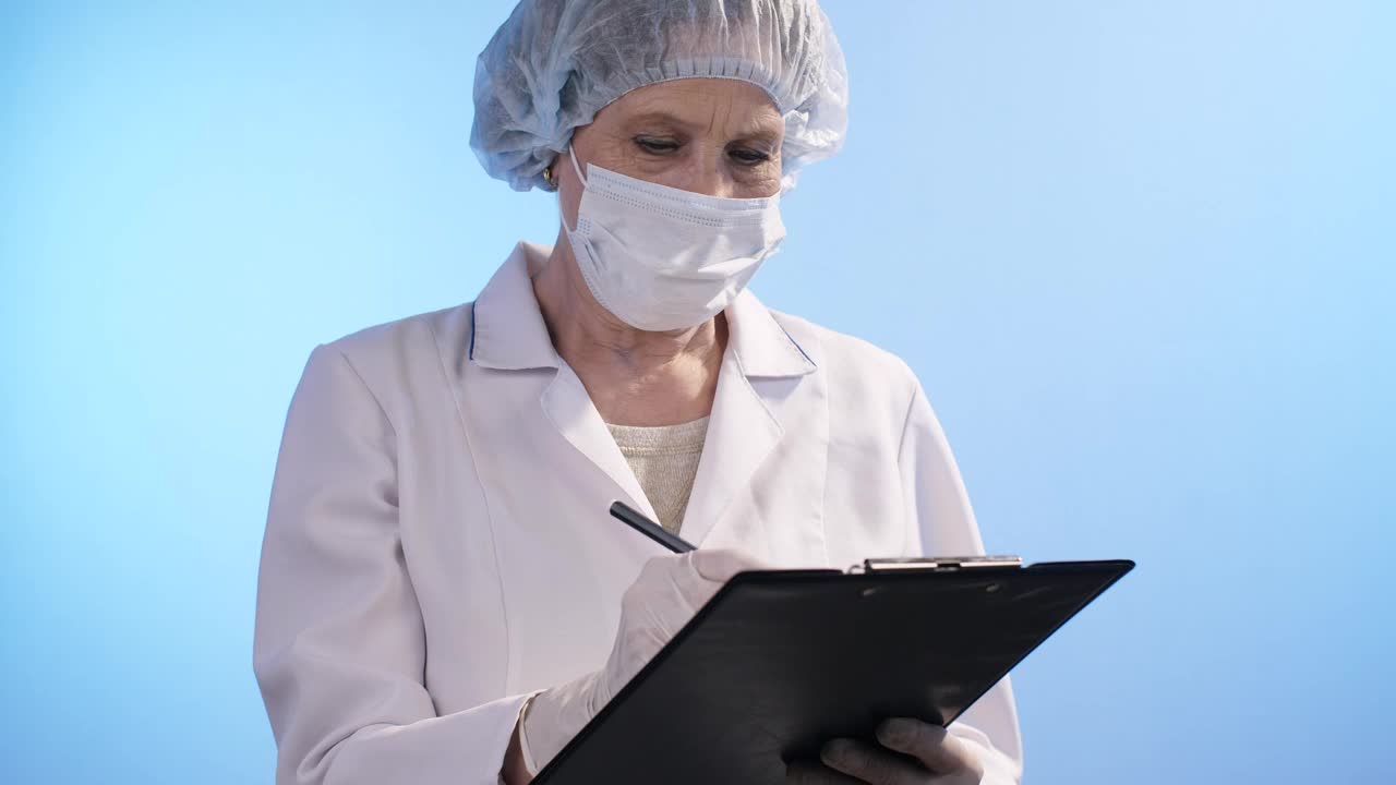 Stock Video Female Doctor Writes In Her Notebook Live Wallpaper For PC - Free Download
