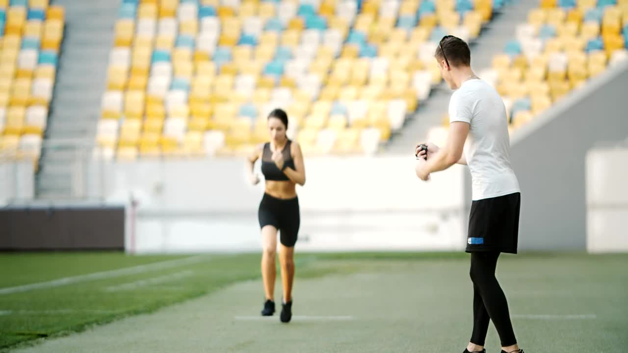Free Video Stock trainer motivates athlete on running track Live Wallpaper - Free Download