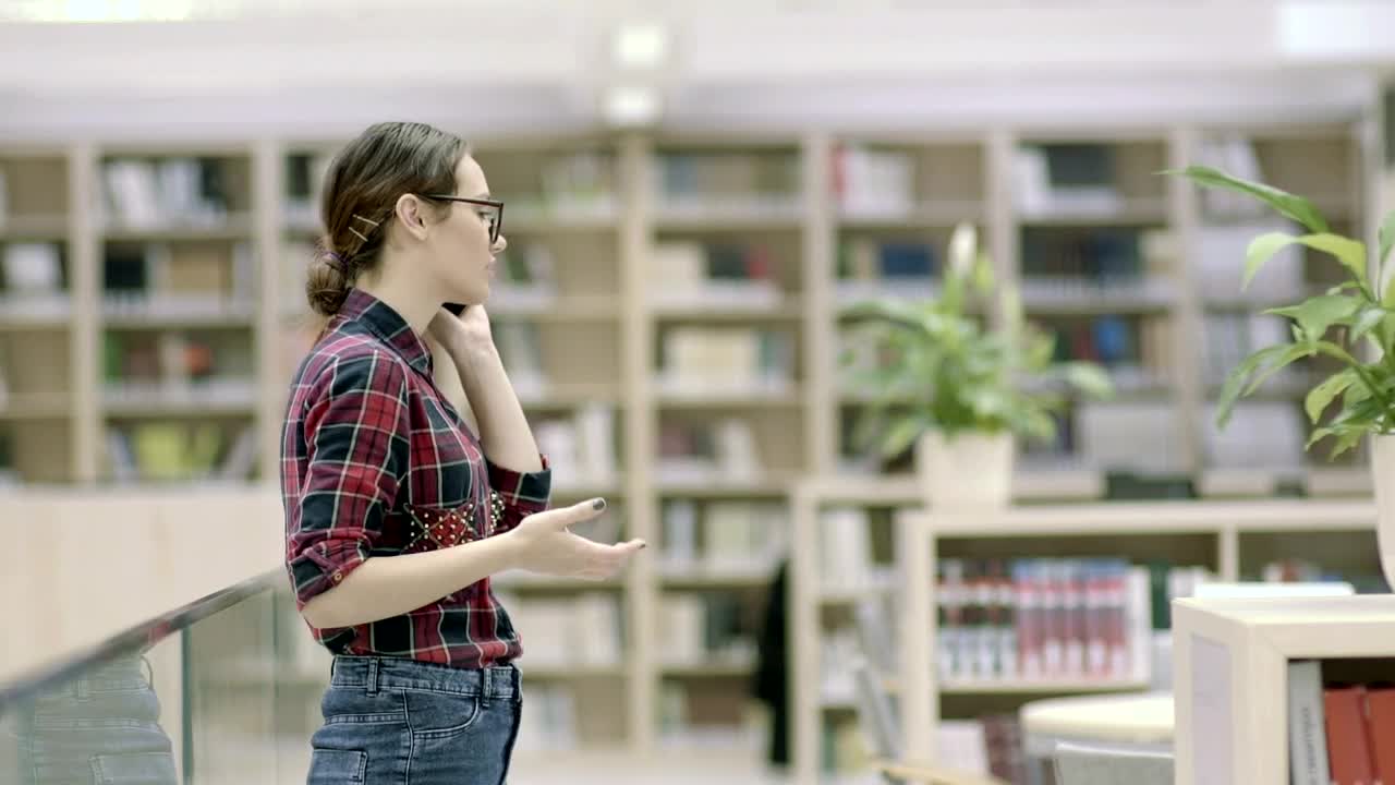 Free Video Stock Student Woman Talking On The Phone In The Library Live Wallpaper - Free Download