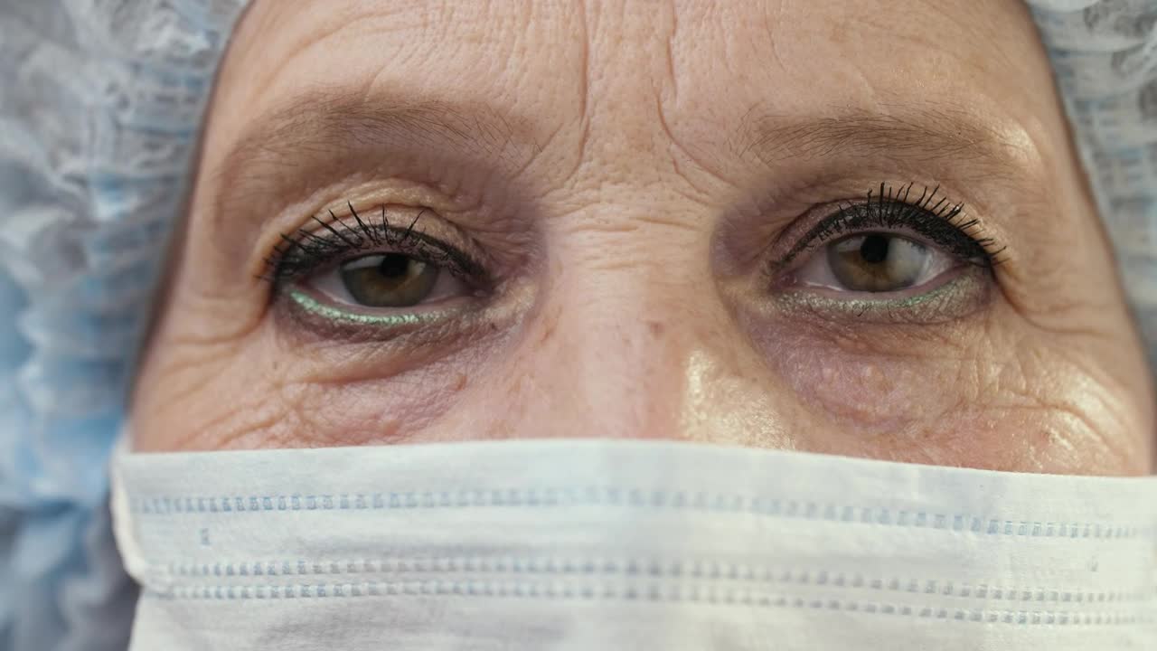 Stock Video Eyes Of An Old Female Doctor Wearing Mask Live Wallpaper For PC - Free Download