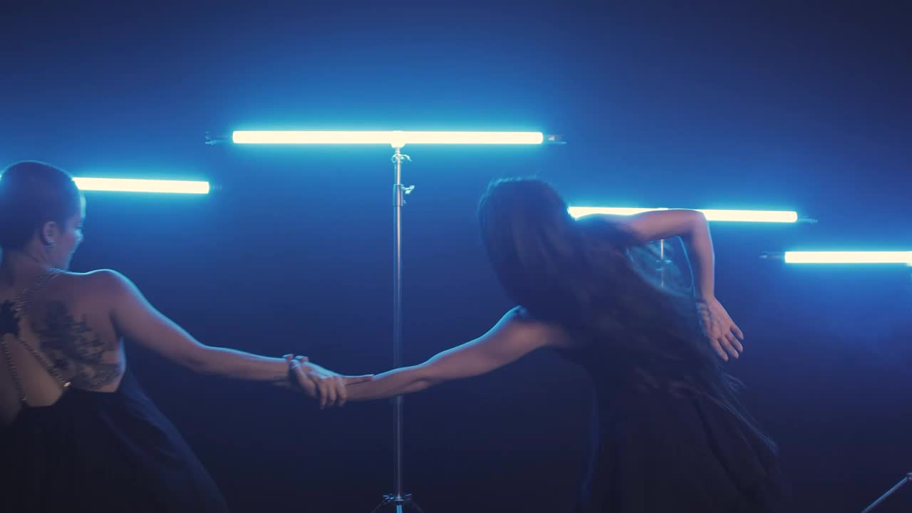 Free Stock Video Two Women Dancing Illuminated With Blue Light Bars Live Wallpaper - Free Download