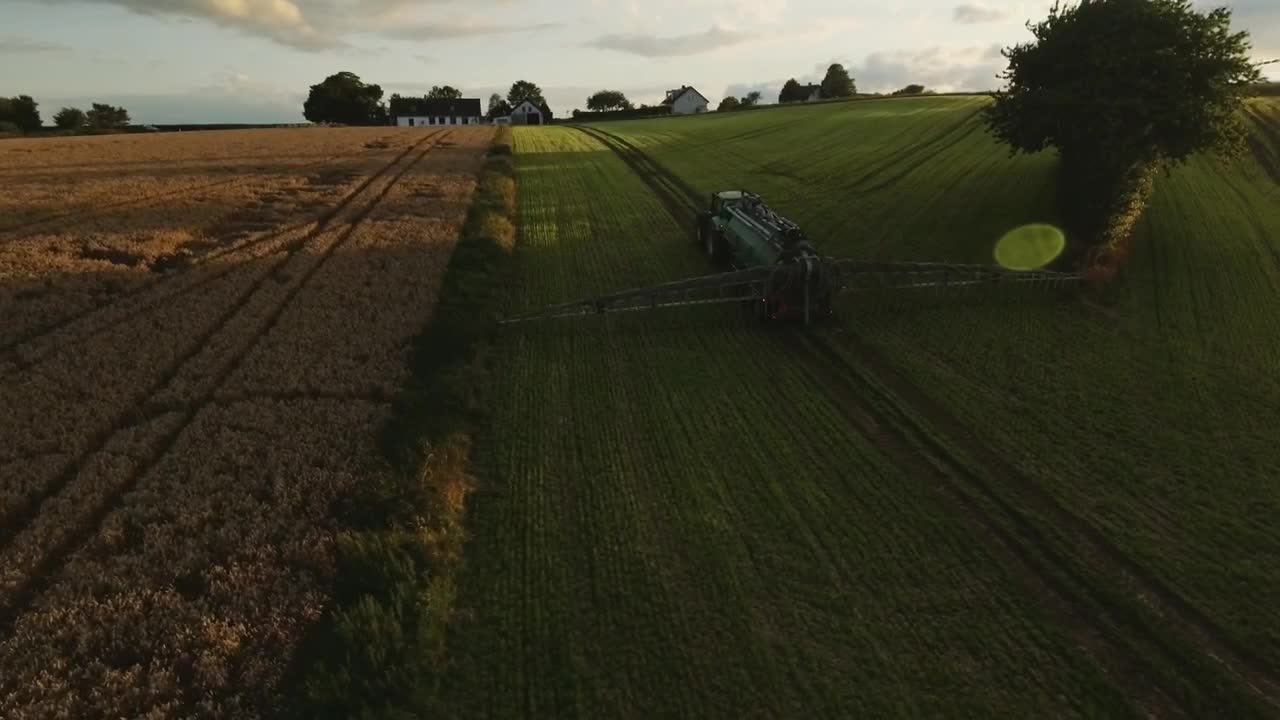 Free Video Stock tractor working near a farmhouse Live Wallpaper - Free Download