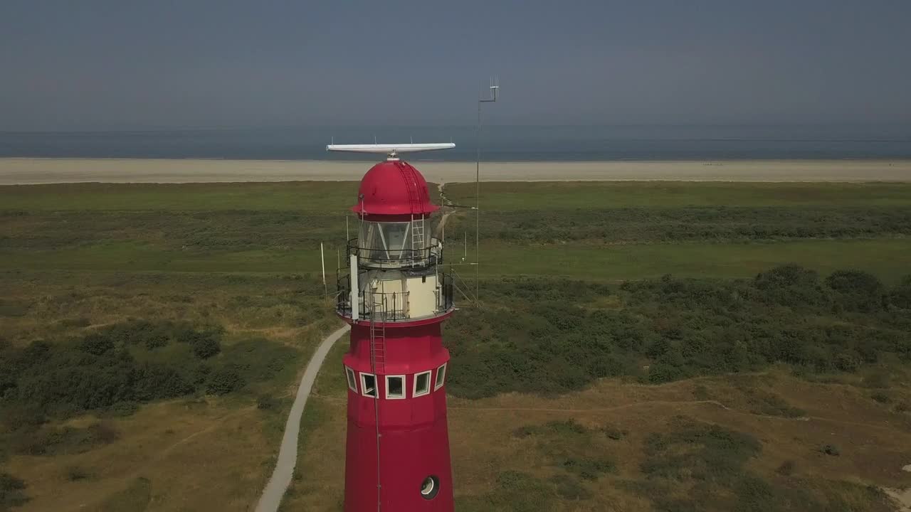 Video Stock Red Lighthouse Near The Shore Spinning Aerial Shot Live Wallpaper Free - Free Download