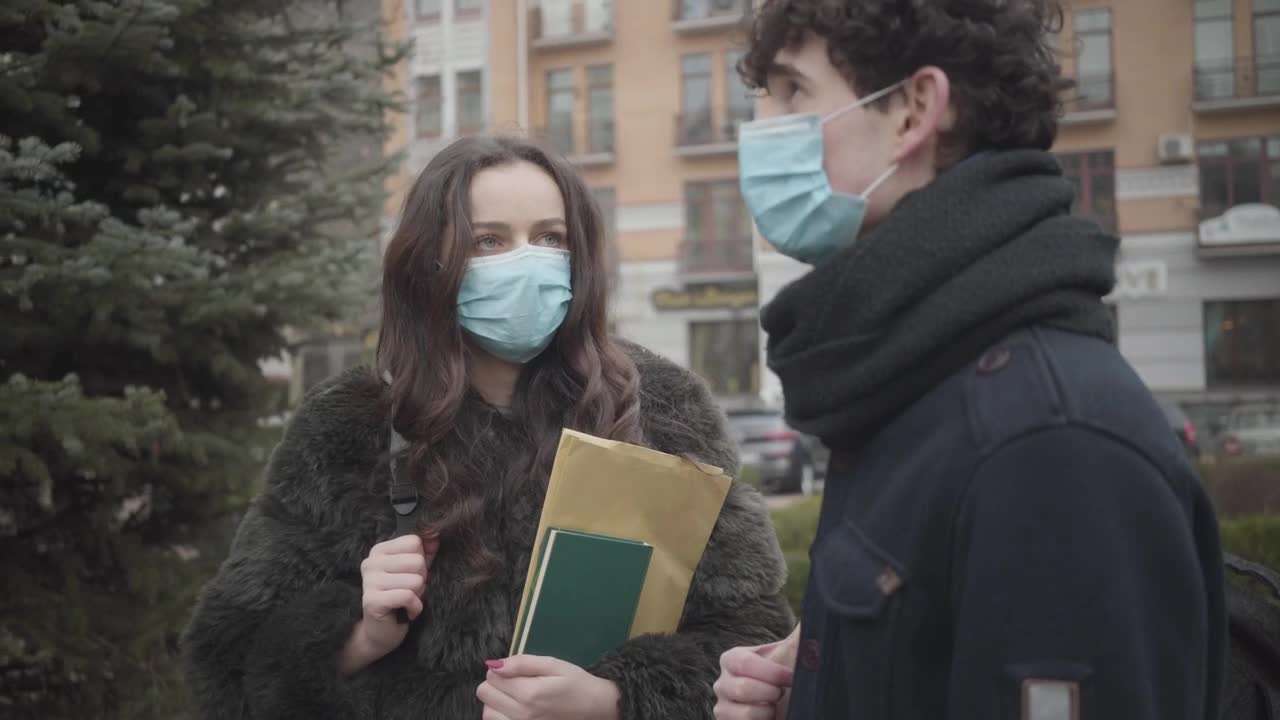 Stock Video Pair Of Boys With Masks Talking On The Street Live Wallpaper - Free Download