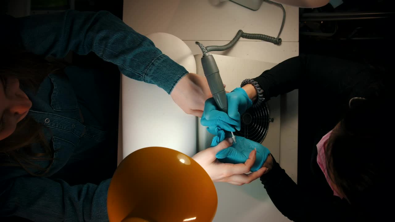 Free Stock Video Woman Filing A Girls Nails In A Manicure Session Live Wallpaper - Free Download
