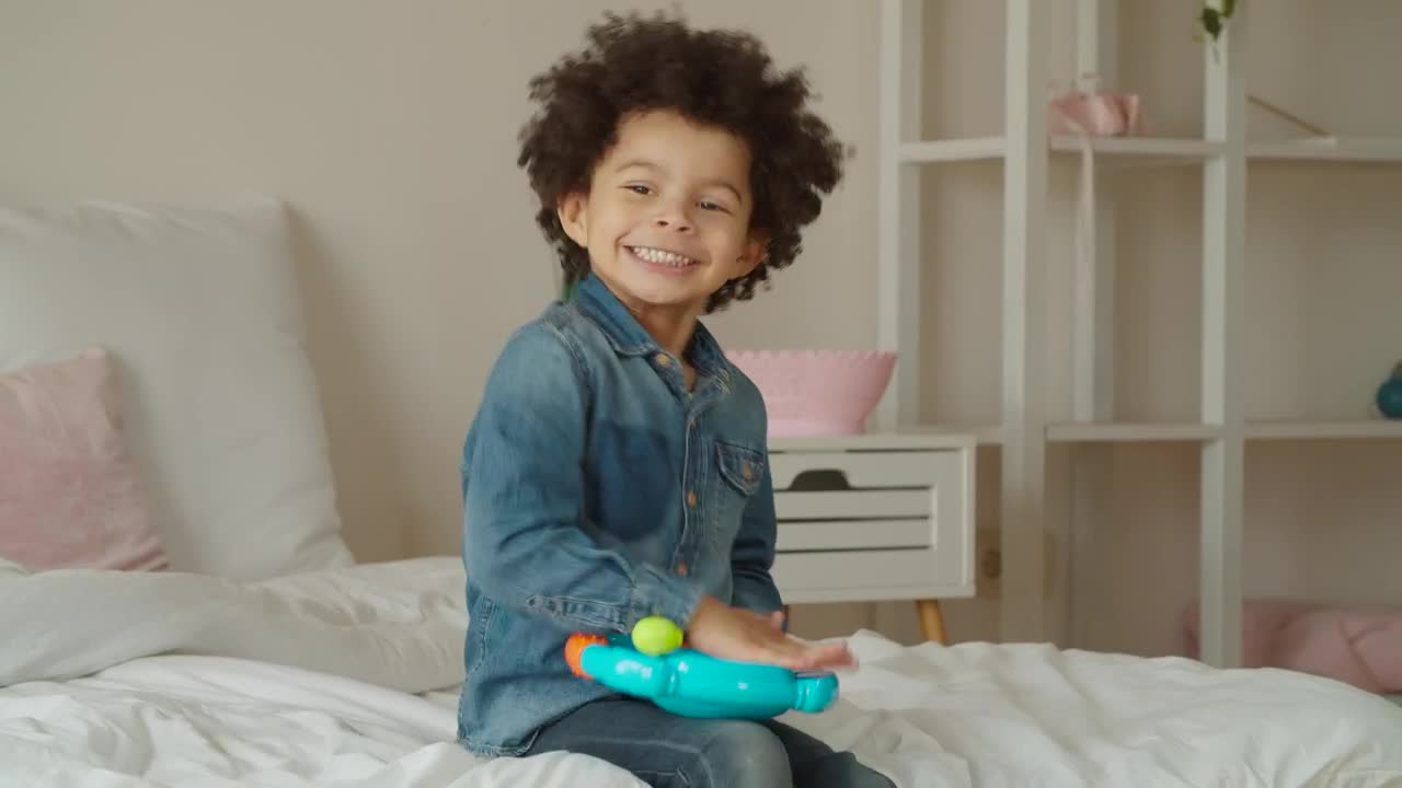 Stock Video Little Boy Happily Playing With A Toy Animated Wallpaper - Free Download