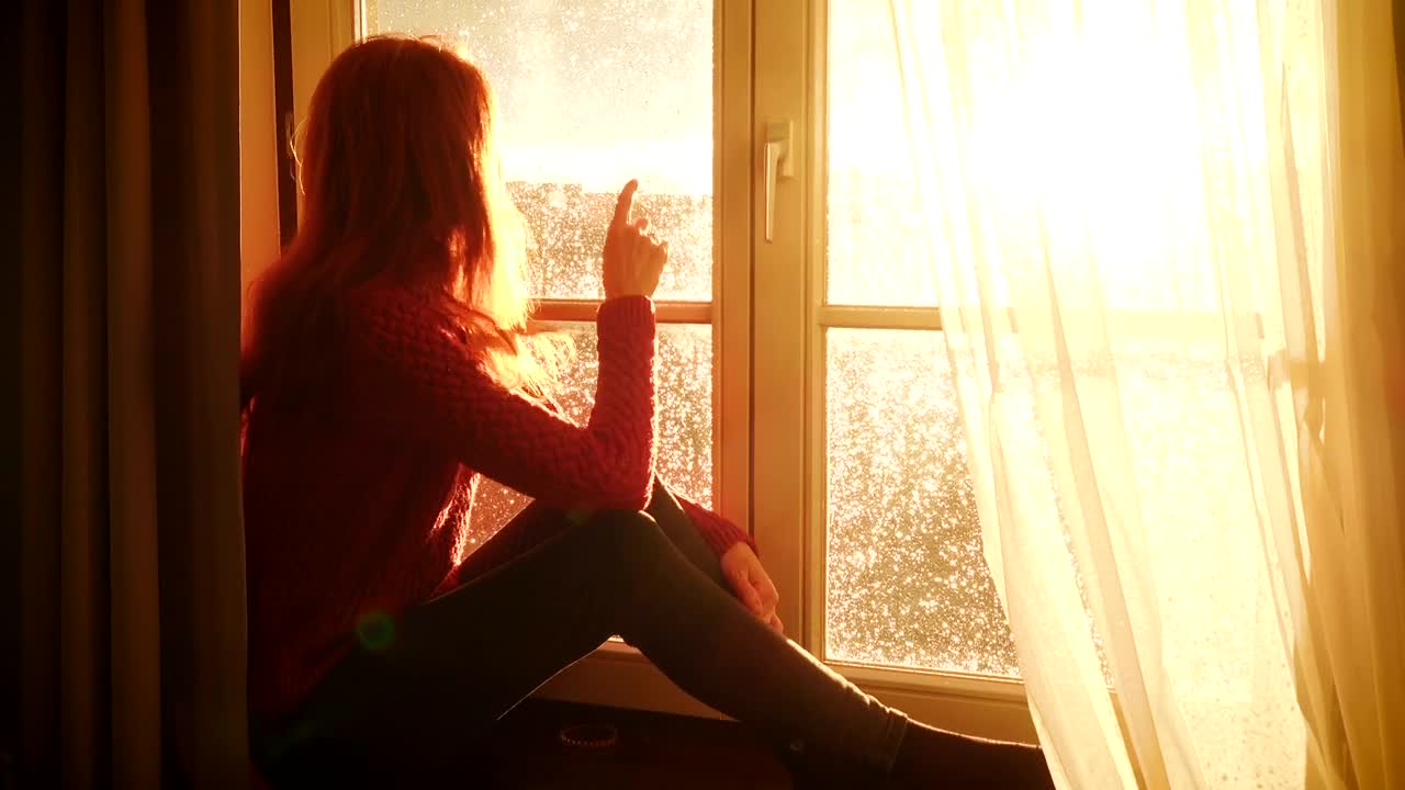 Stock Video Nostalgic Woman Watching The Sunset By The Window Live Wallpaper - Free Download