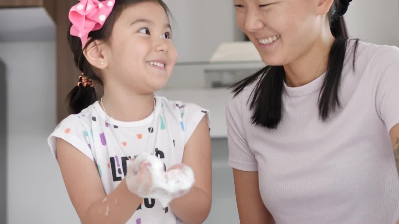 Stock Video Happy Mother And Daughter Cleaning Their House Animated Wallpaper - Free Download