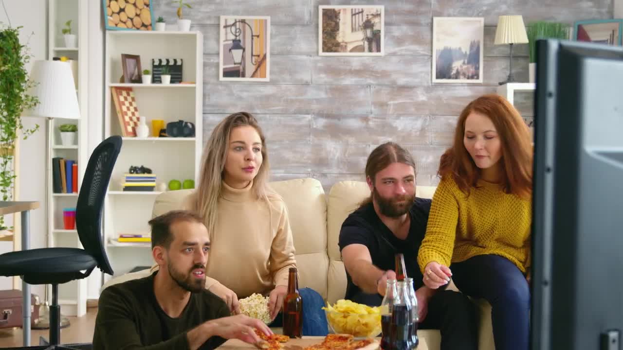 Stock Video Man Clapping While Watching Tv With Friends Animated Wallpaper - Free Download