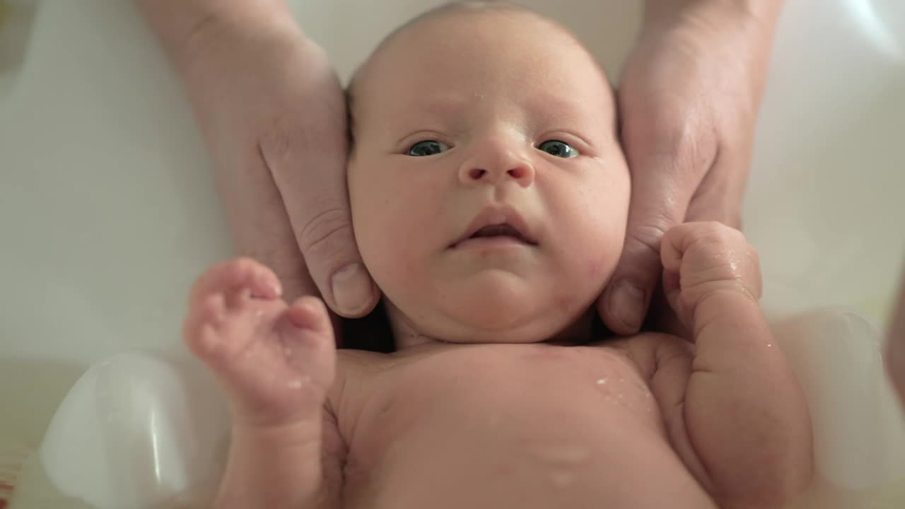 Stock Video Parents Bathing A Newborn Baby Live Wallpaper - Free Download