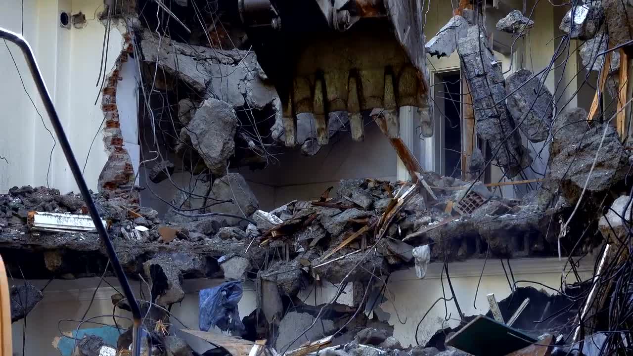 Stock Video Mechanical Arm Of A Bulldozer Knocking Down Debri Animated Wallpaper - Free Download
