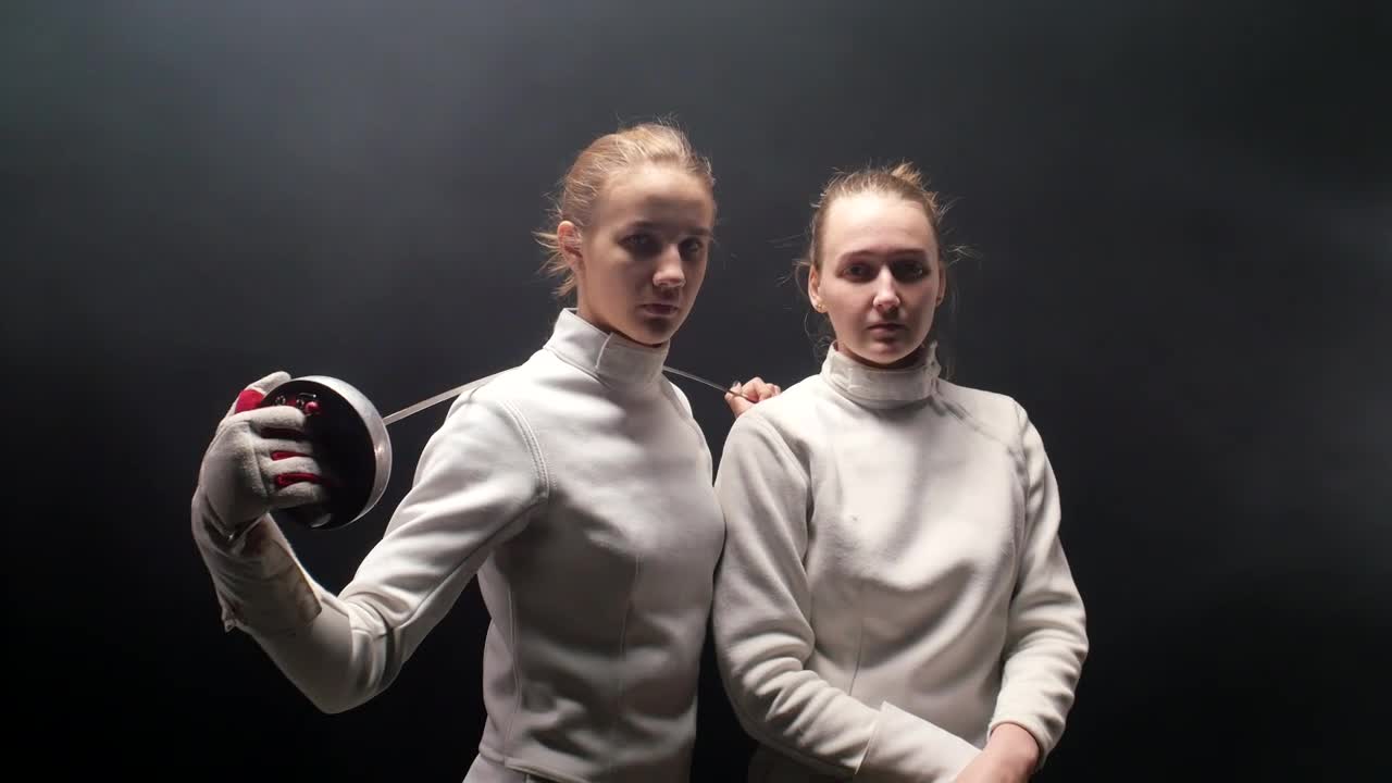 Stock Video Female Fencers Head On With A Dark Background Live Wallpaper For PC - Free Download