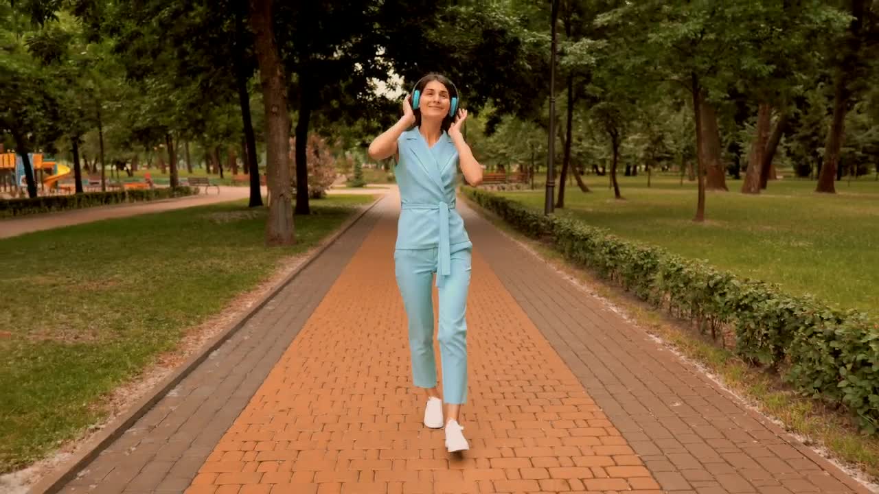 Stock Video Girl Listens To Music And Dances Happily Live Wallpaper For PC - Free Download