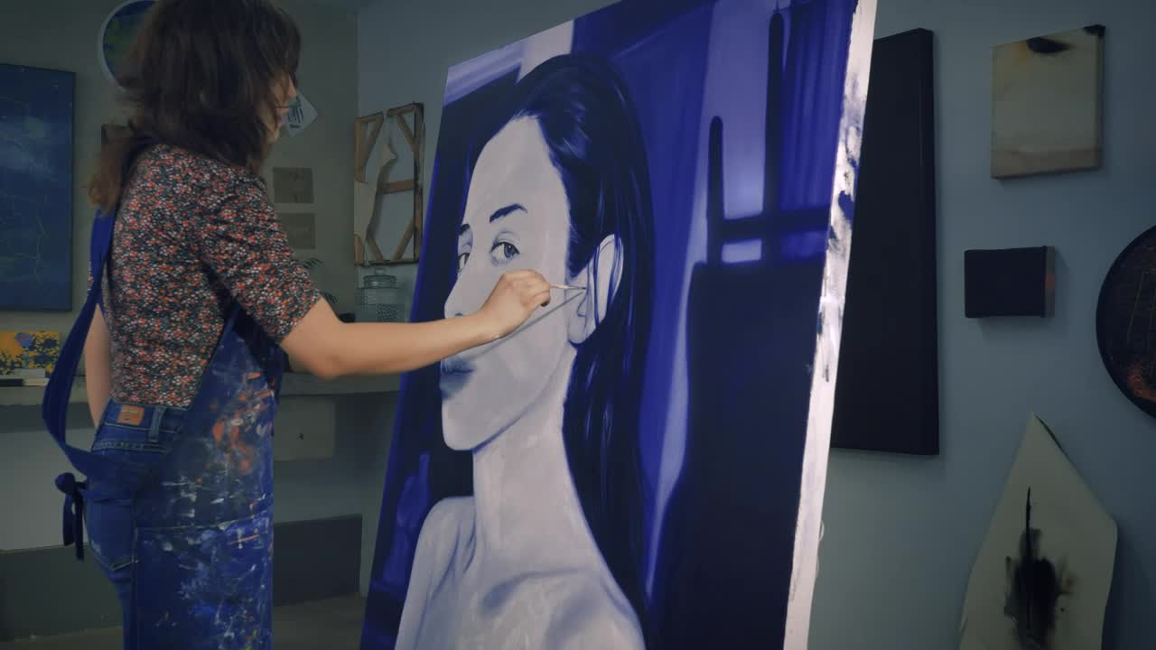 Stock Video Painter Working On A Portrait In Blue Tones Live Wallpaper - Free Download