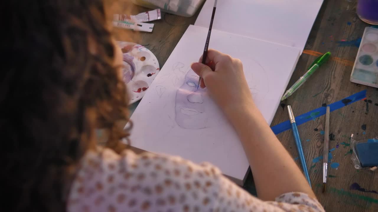 Stock Video Focus On The Hand Of An Artist Girl Painting With Live Wallpaper For PC - Free Download