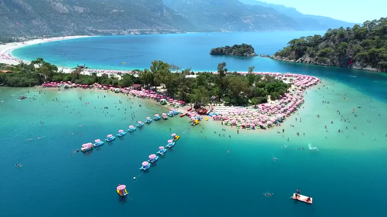 Free Video Stock tourists beach and the blue ocean Live Wallpaper - Free Download