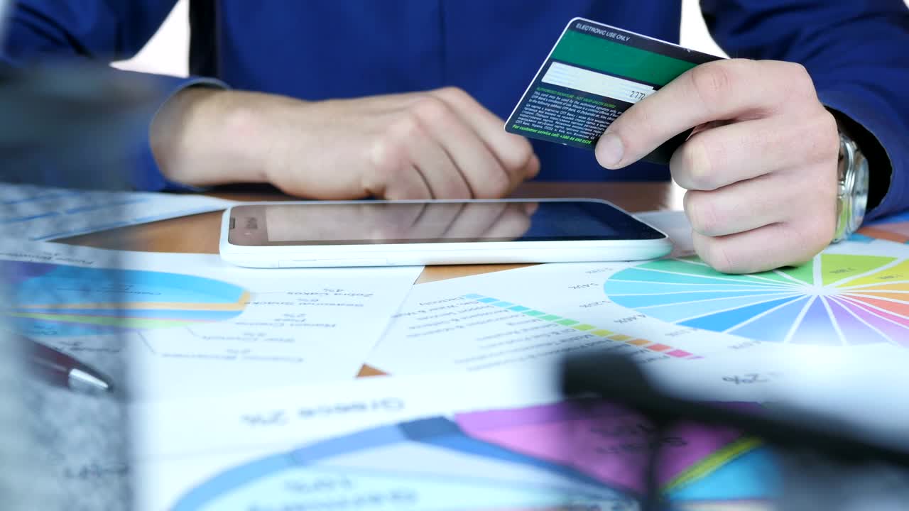 Stock Video Man Entering Credit Card Details On His Device Animated Wallpaper - Free Download