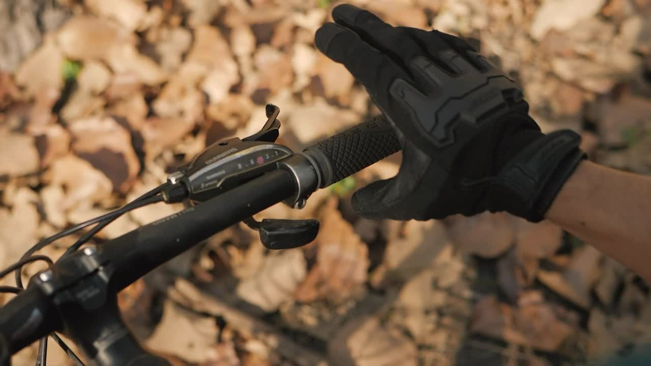 Stock Video Hands Of A Cyclist Taking The Handlebars Of His Bicycle Animated Wallpaper - Free Download