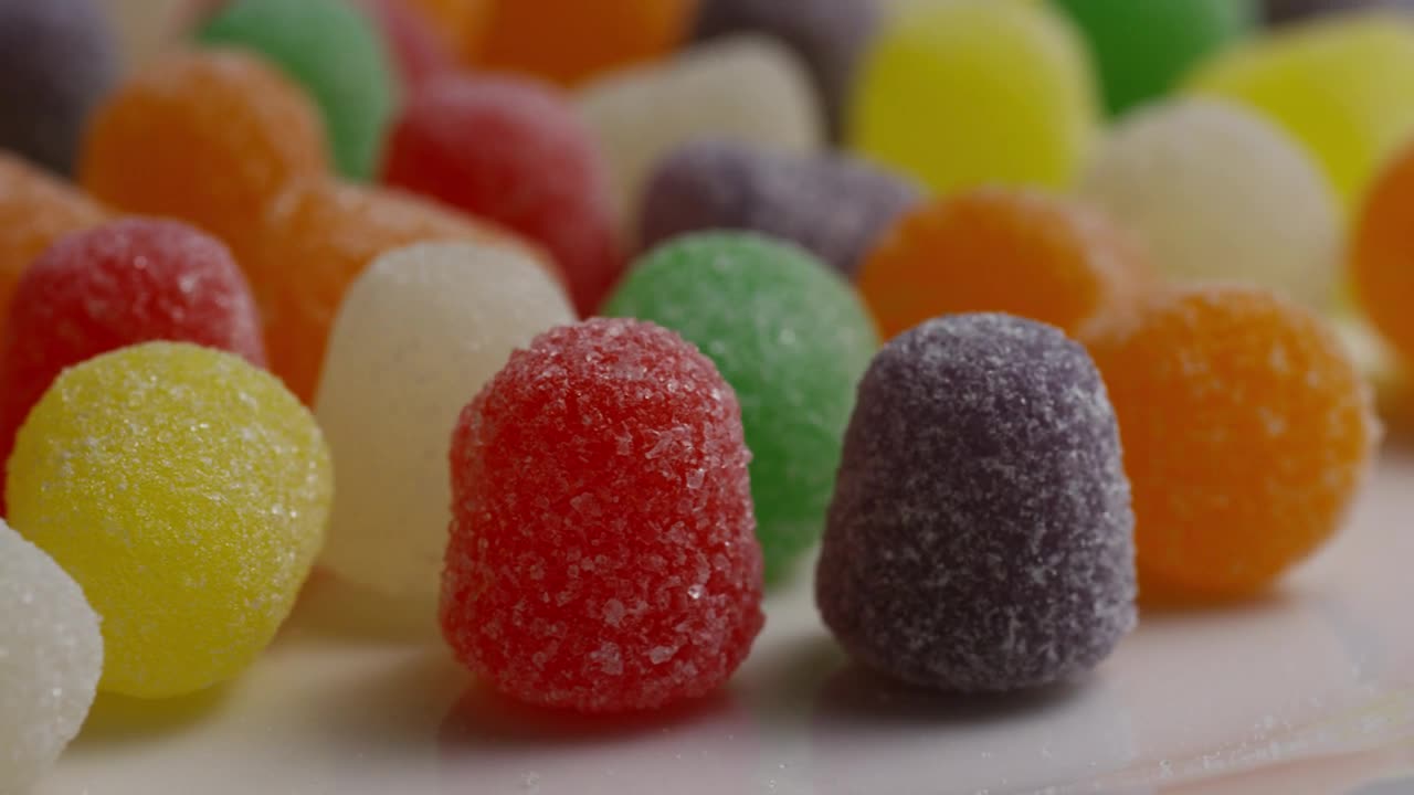 Stock Video Colored Sugar Gummies Slowly Rotating Live Wallpaper For PC - Free Download