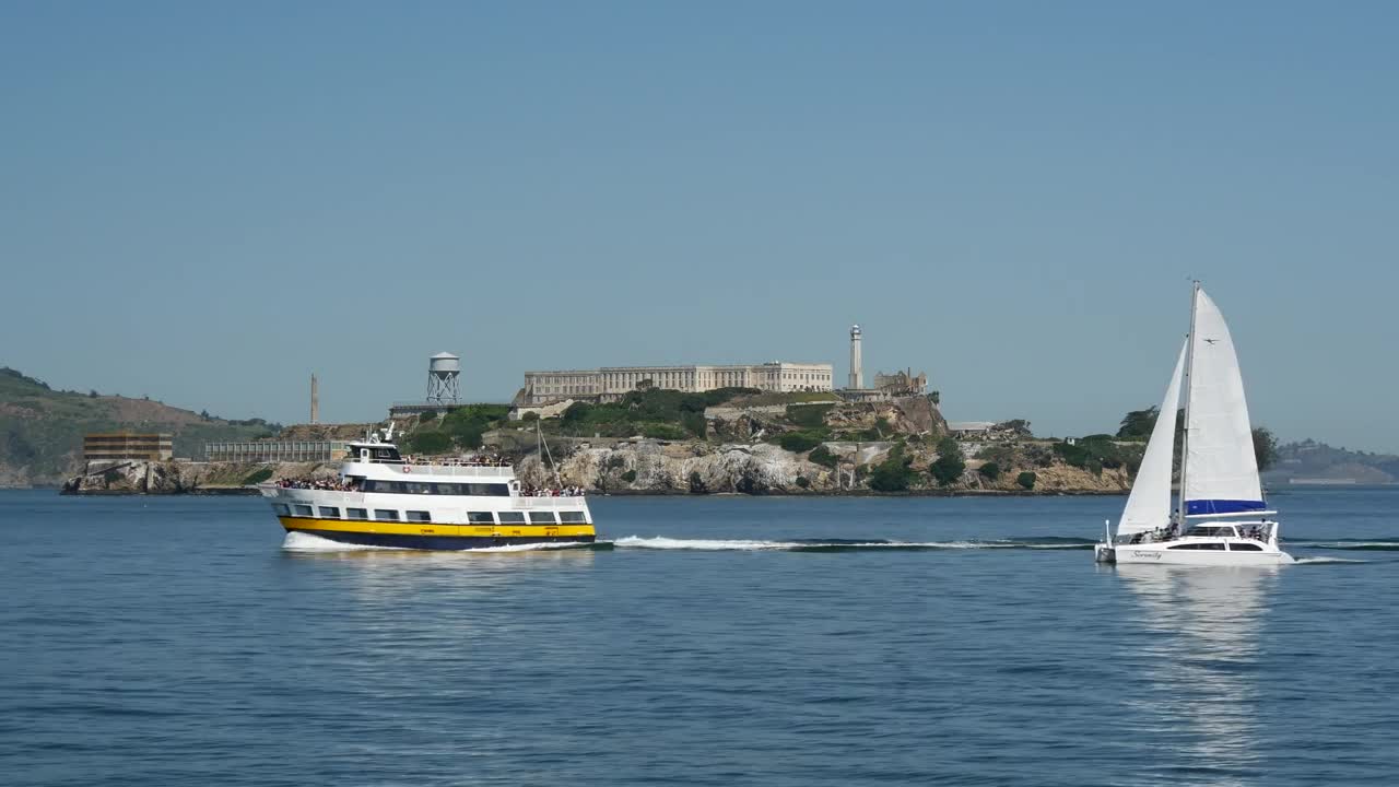 Stock Video Ferry And Sailboat Passing By Alcatraz Island In San Francisco Live Wallpaper For PC - Free Download