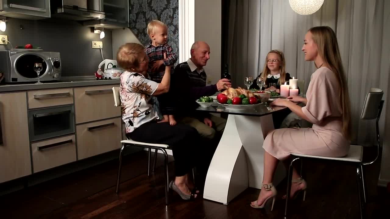 Stock Video Mother And Her Children At A Dinner With Grandparent Animated Wallpaper - Free Download