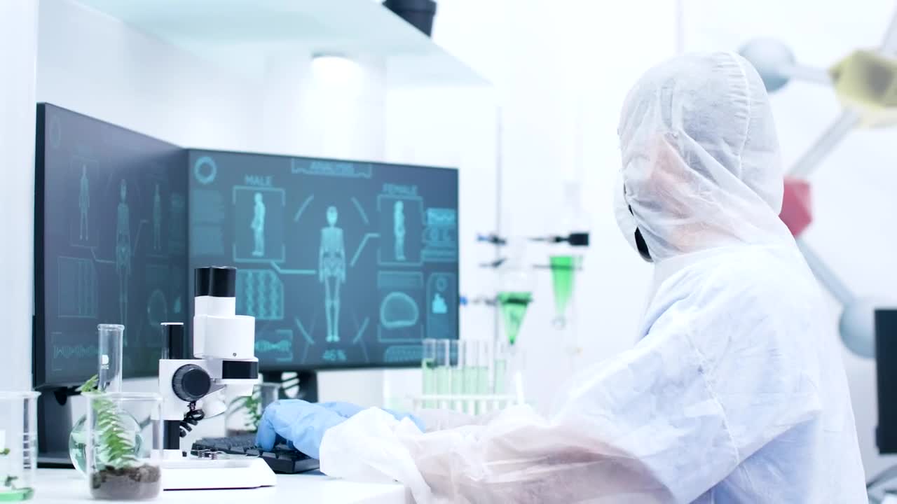 Stock Video Medical Scientist Types And Looks At Human Body Sca Animated Wallpaper - Free Download