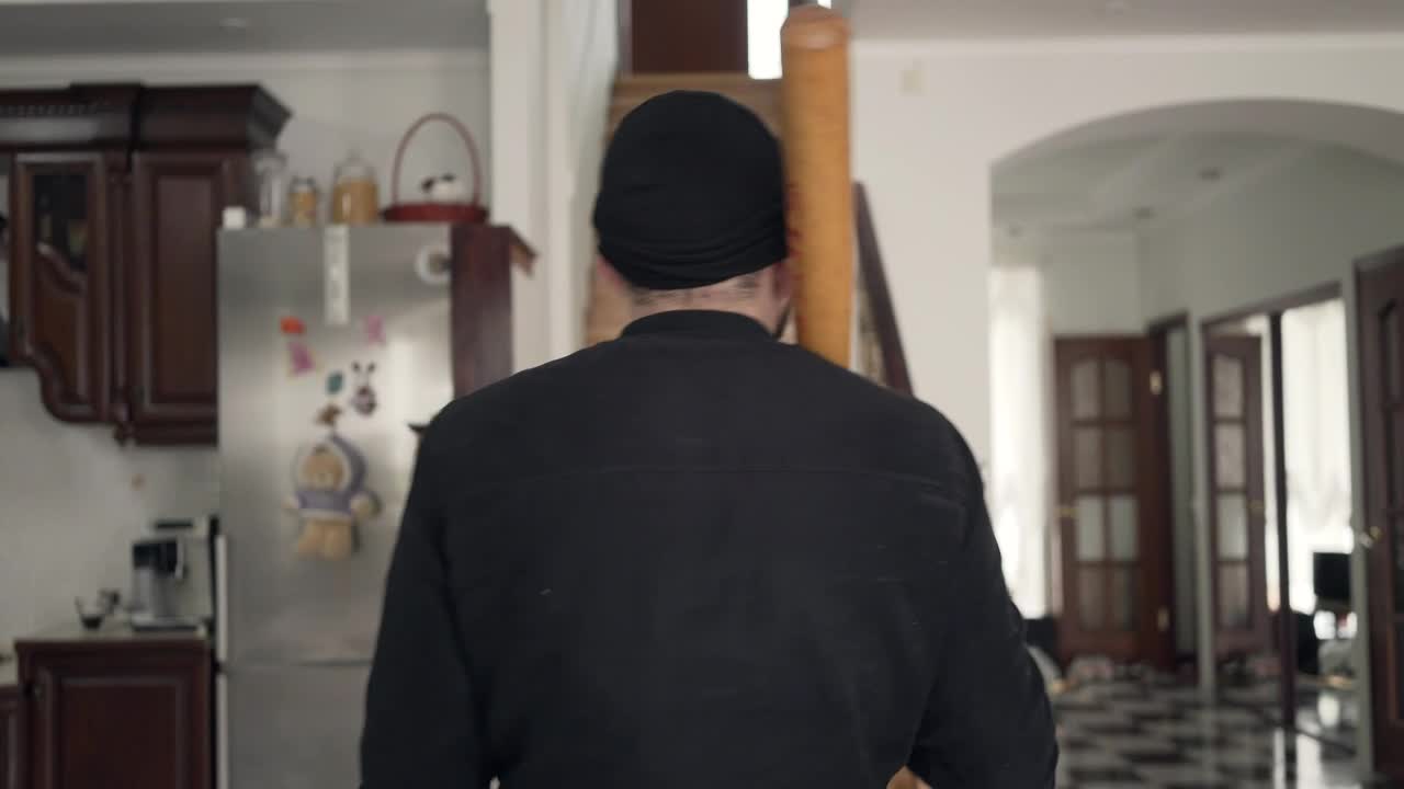 Free Video Stock thief with baseball bat looks around house Live Wallpaper - Free Download