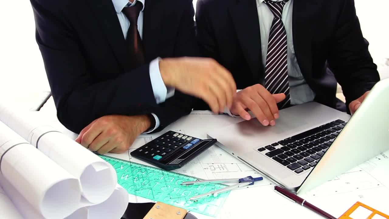 Stock Video Couple Of Architects Working On A Computer Live Wallpaper For PC - Free Download