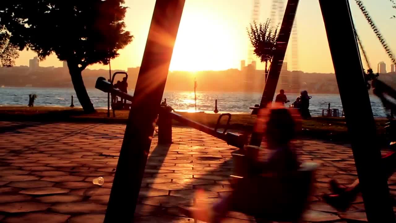 Video Stock Children Swinging In A Park Near The Coast Live Wallpaper For PC - Free Download