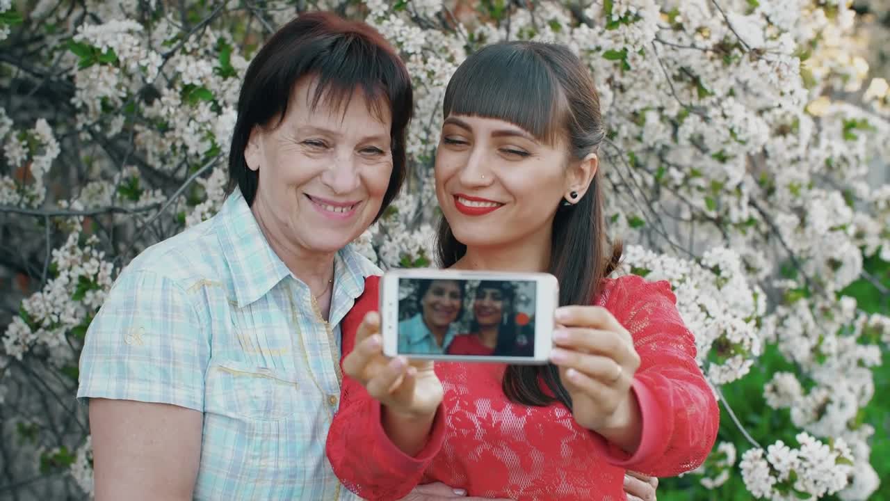 Stock Video Daughter Takes A Selfie With Her Mother Live Wallpaper For PC - Free Download