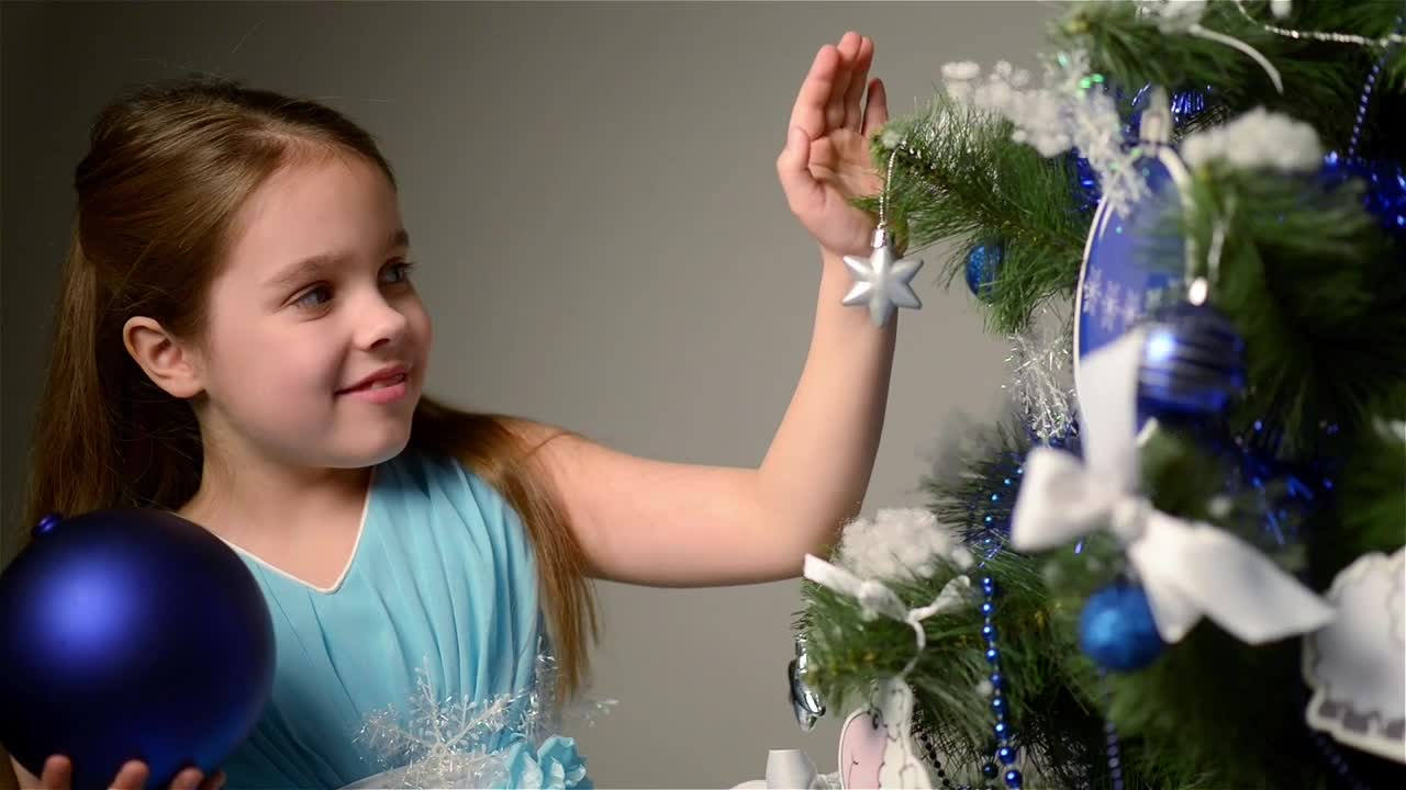 Stock Video Little Girl Decorating Her Christmas Tree Animated Wallpaper - Free Download
