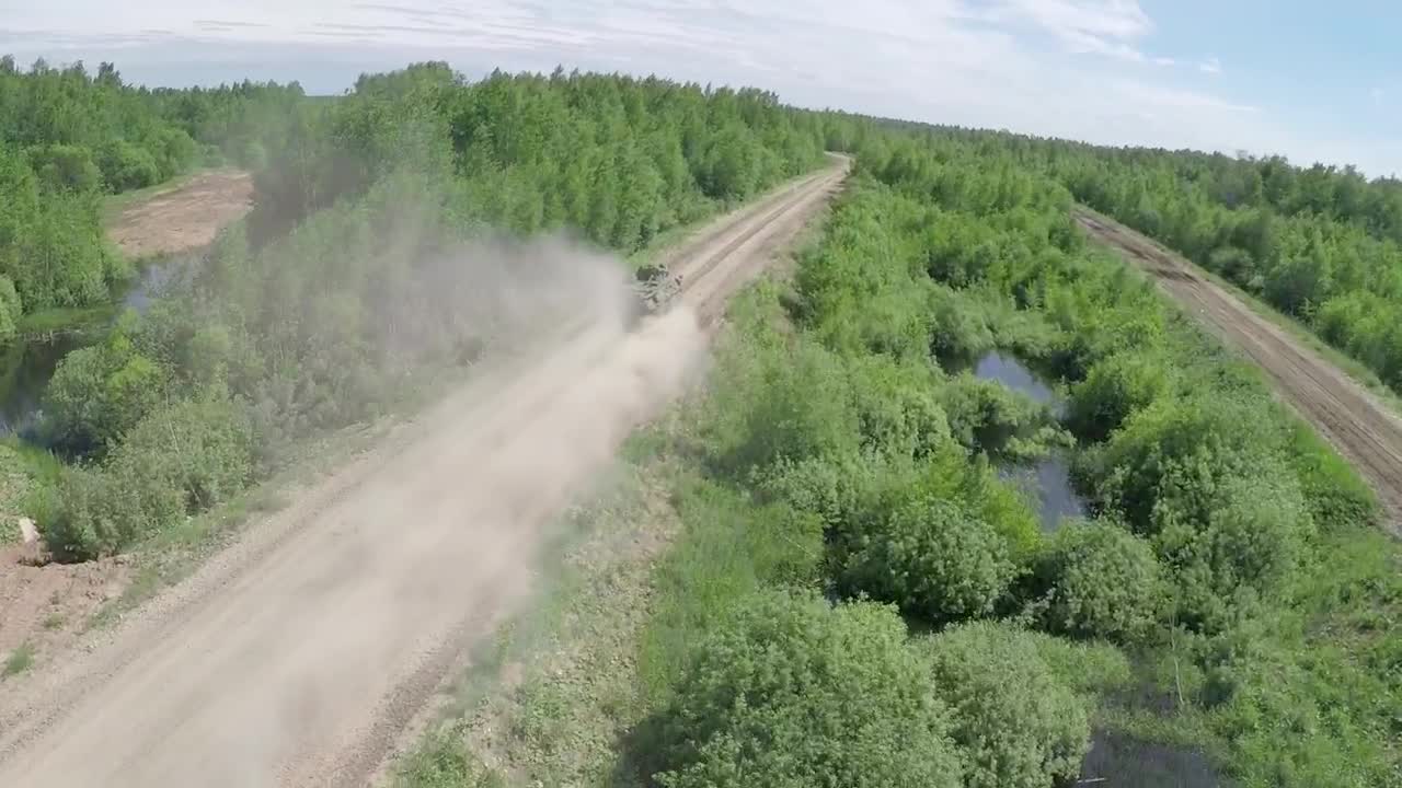 Stock Video Military Vehicle Heading Down A Dusty Roa Animated Wallpaper - Free Download