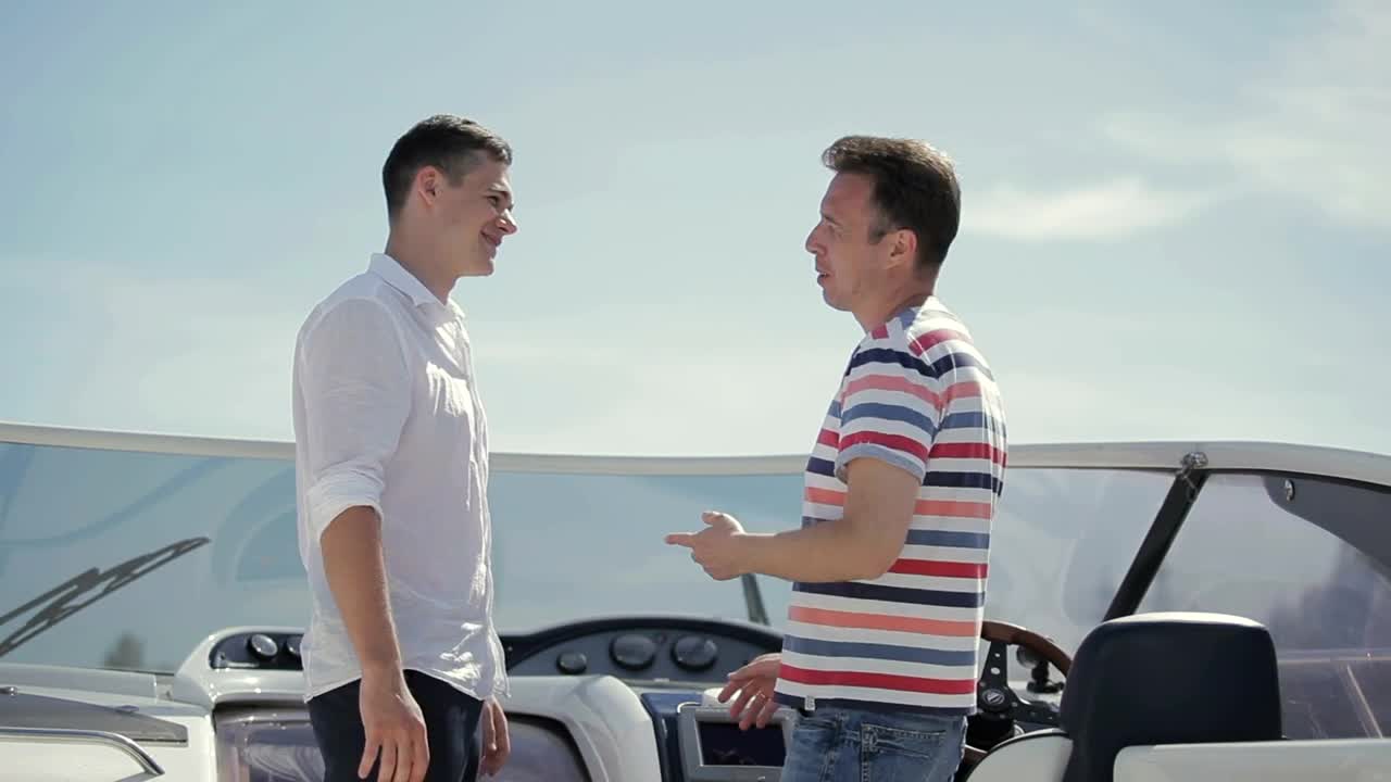 Stock Video Men Handshake Over Deal On Deck Of Yach Animated Wallpaper - Free Download