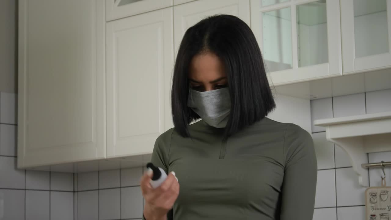 Free Stock Video Woman Using The Hand Sanitizer In The Kitchen Live Wallpaper - Free Download
