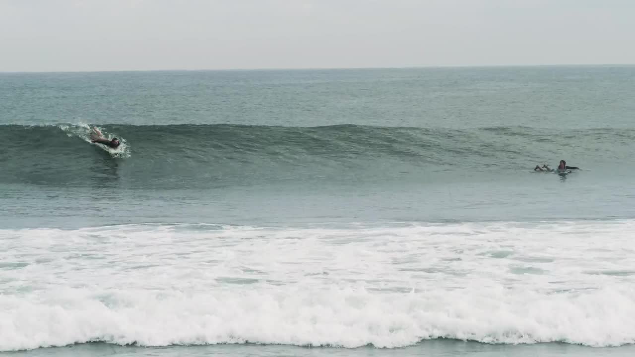 Free Video Stock tracking shot of a person surfing waves Live Wallpaper - Free Download