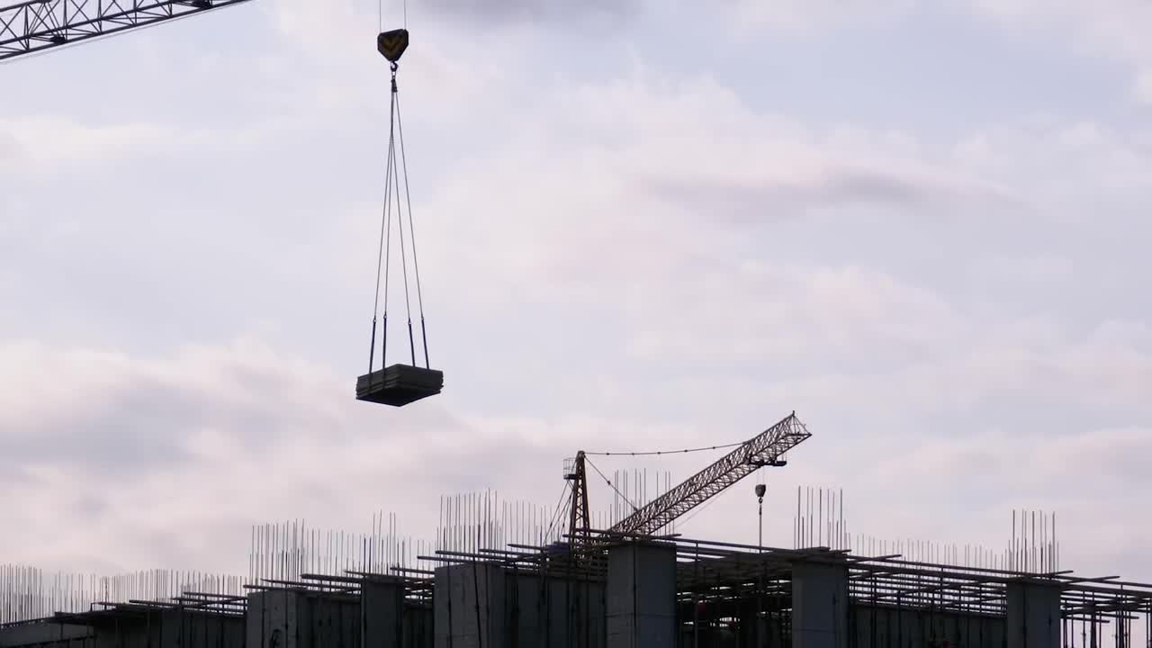 Free Video Stock tower crane with load on a construction site Live Wallpaper - Free Download