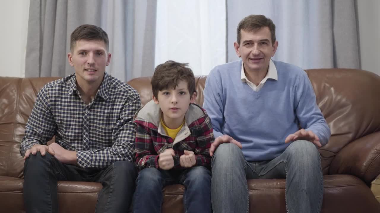 Stock Video Family Of Football Fans Cheer On Sofa Watching Game Live Wallpaper For PC - Free Download