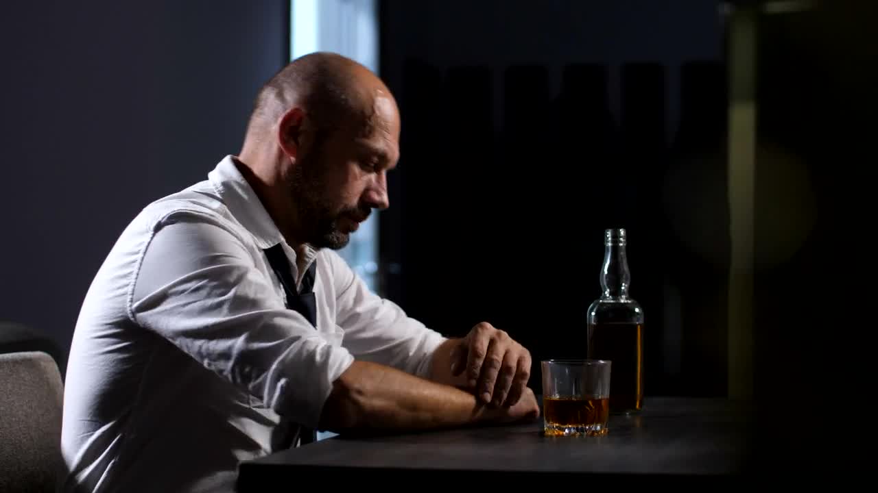 Stock Video Depressed Man With A Bottle Of Whisky Live Wallpaper For PC - Free Download