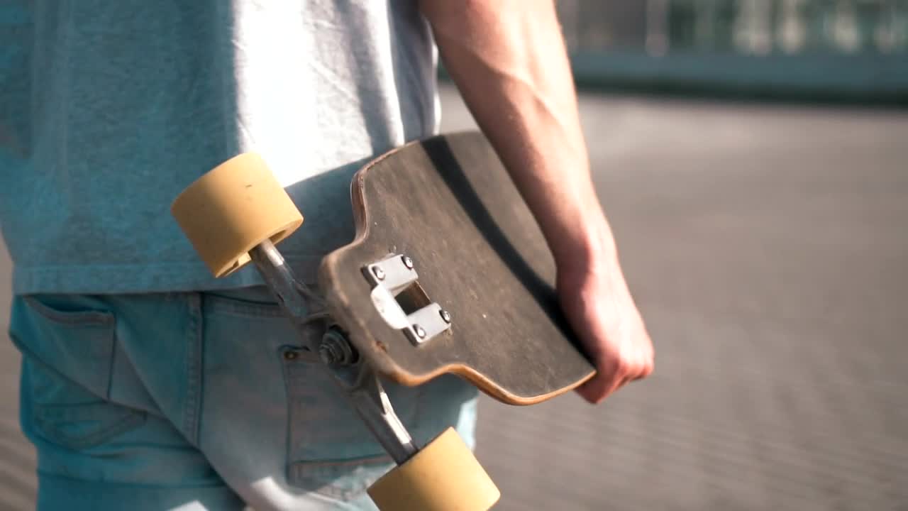 Free Stock Video Skateboarder Walking With His Skateboard Live Wallpaper - Free Download