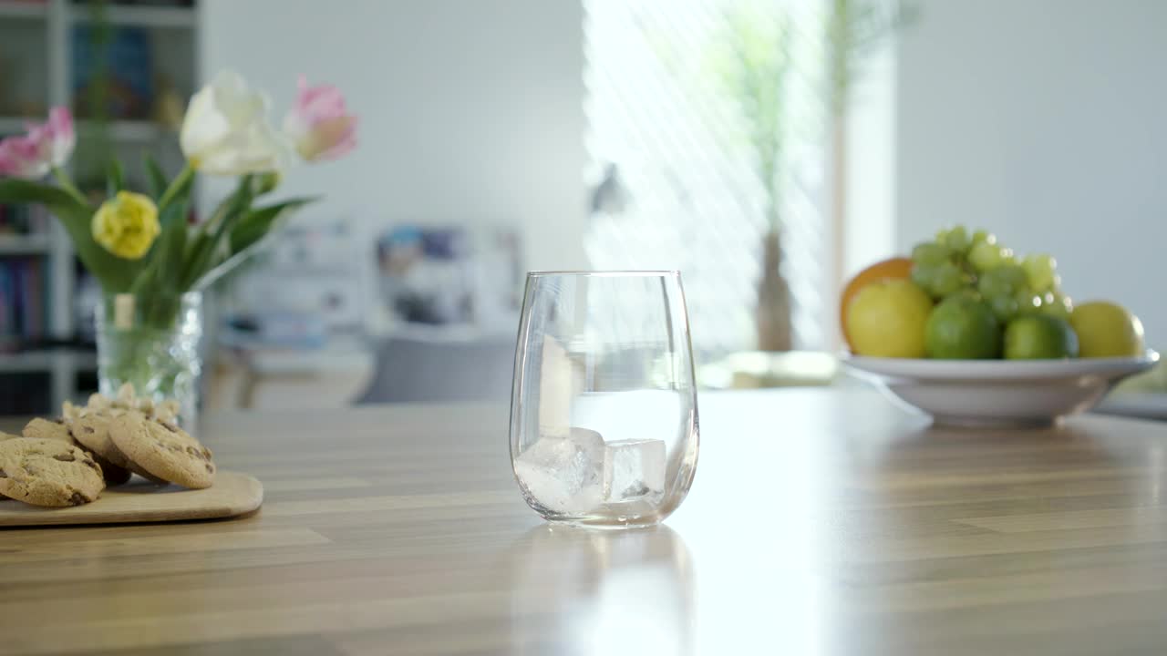 Stock Video Filling A Glass With Sparkling Water In The Kitchen Table Live Wallpaper For PC - Free Download