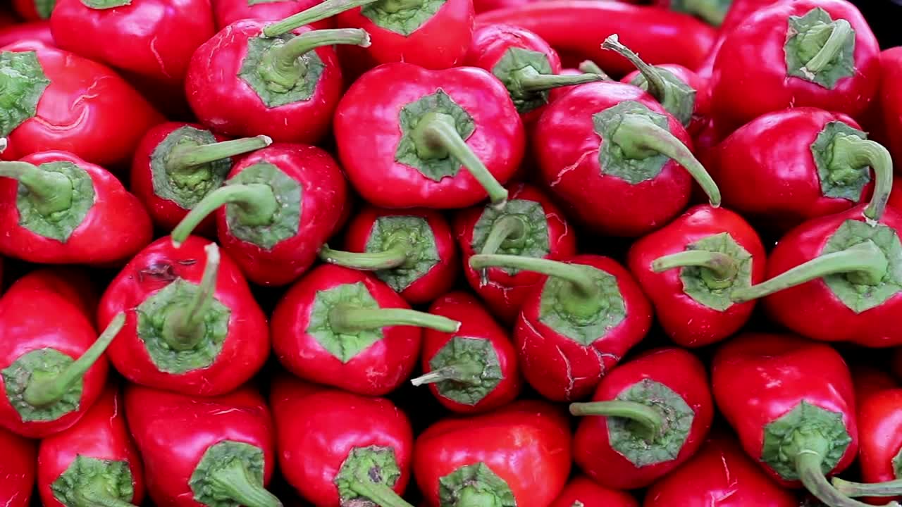 Free Video Stock taking some stacked red chillies Live Wallpaper - Free Download