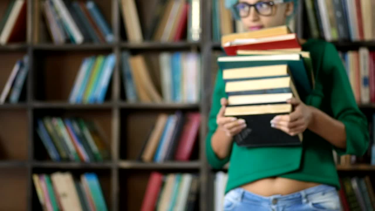 Stock Footage Woman Carrying A Lot Of Books Live Wallpaper - Free Download