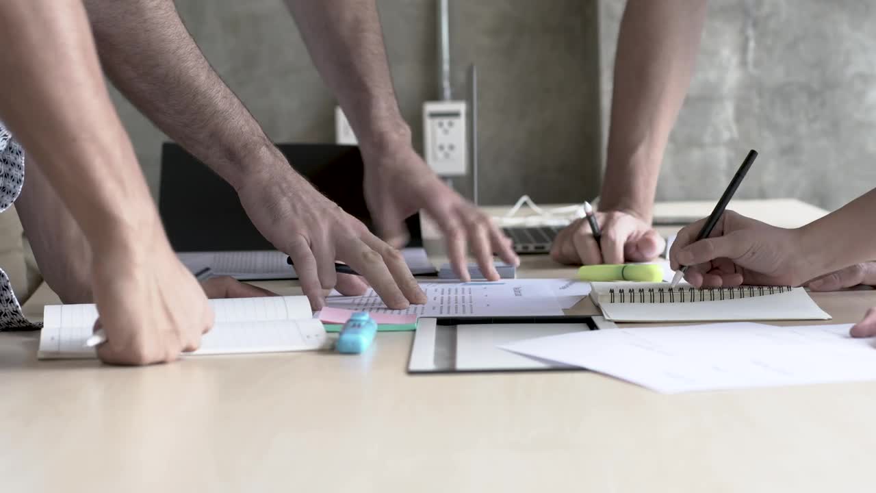 Stock Video Peoples Hands On A Table In A Business Meeting Live Wallpaper - Free Download