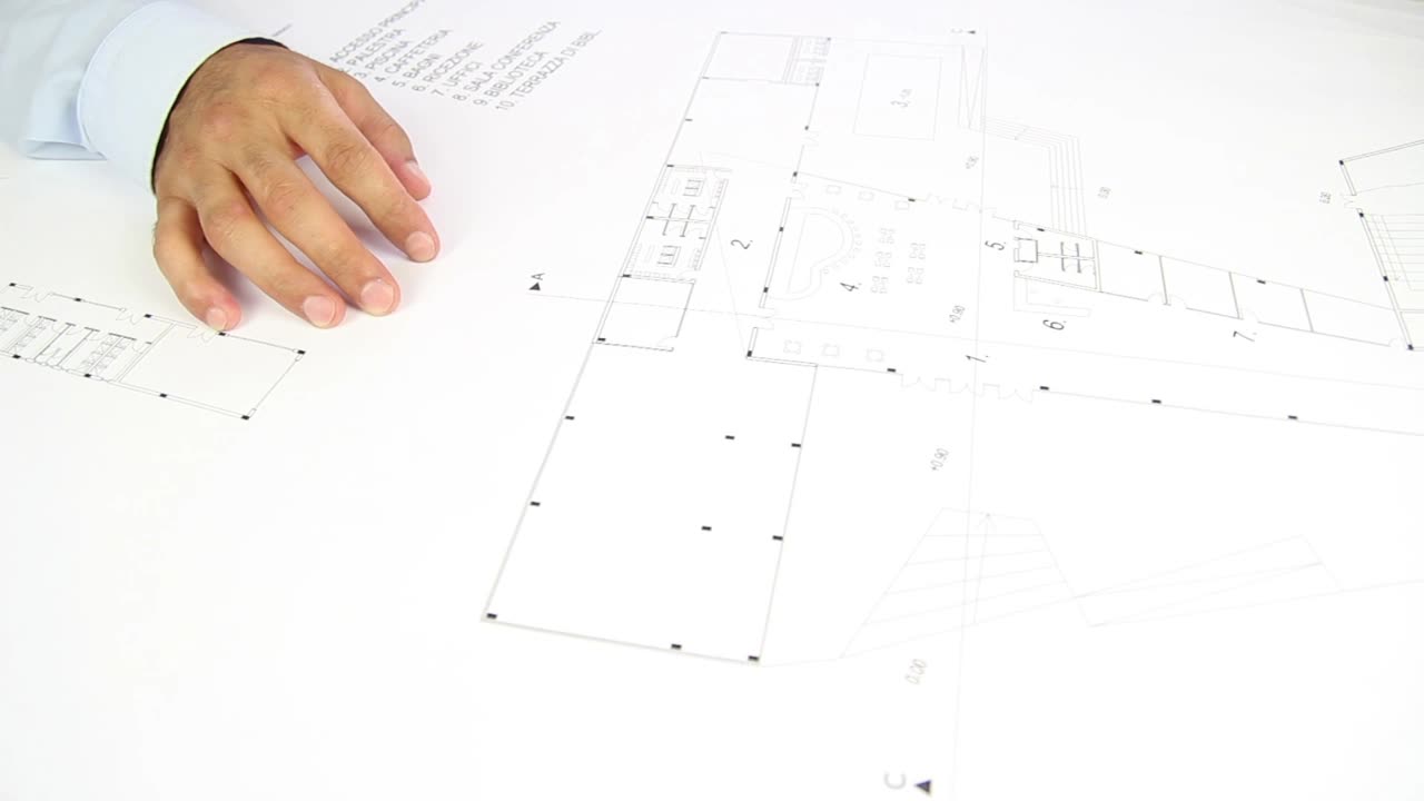 Stock Video People Hands Unrolling A Blueprint On A Table Live Wallpaper - Free Download