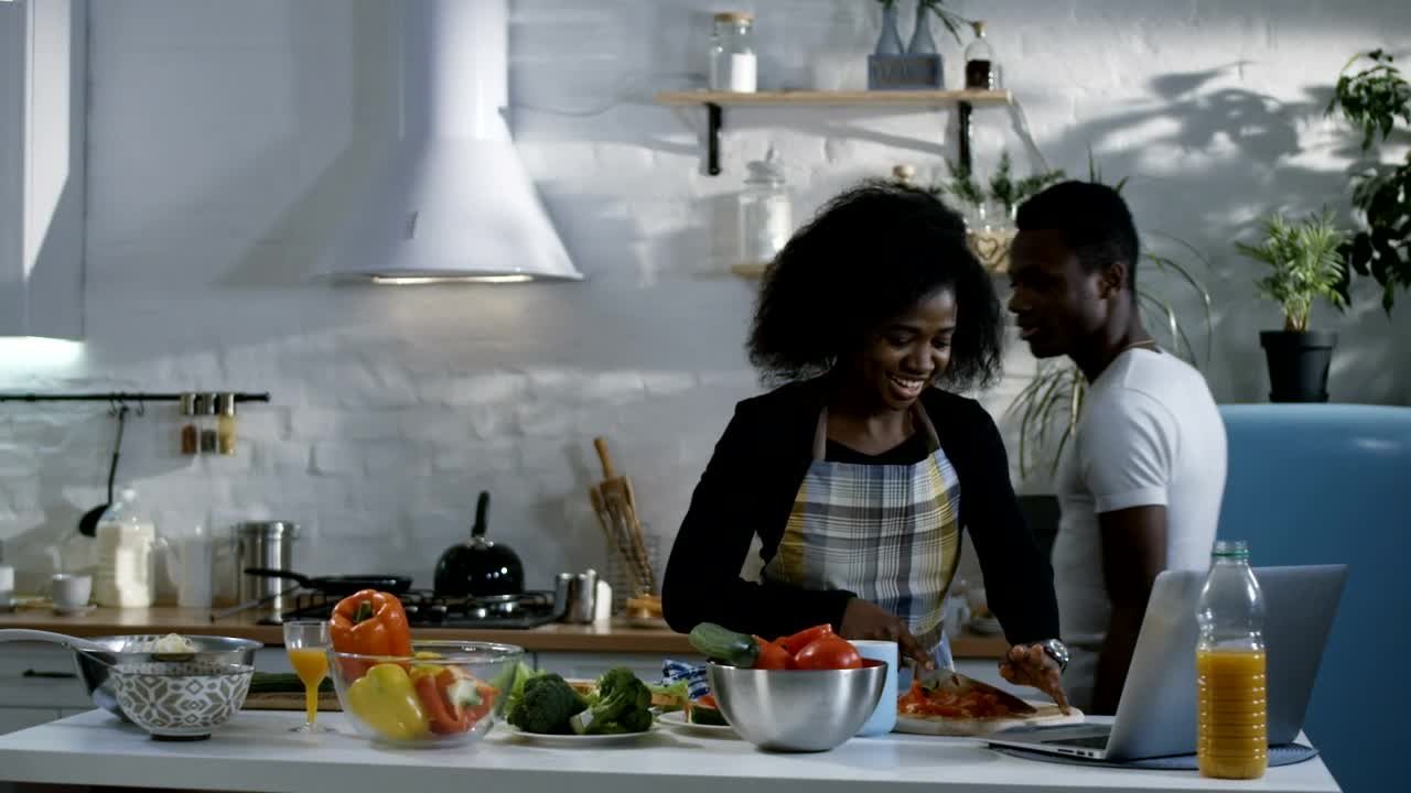Stock Video Couple Preparing Food Following A Tutorial Live Wallpaper For PC - Free Download