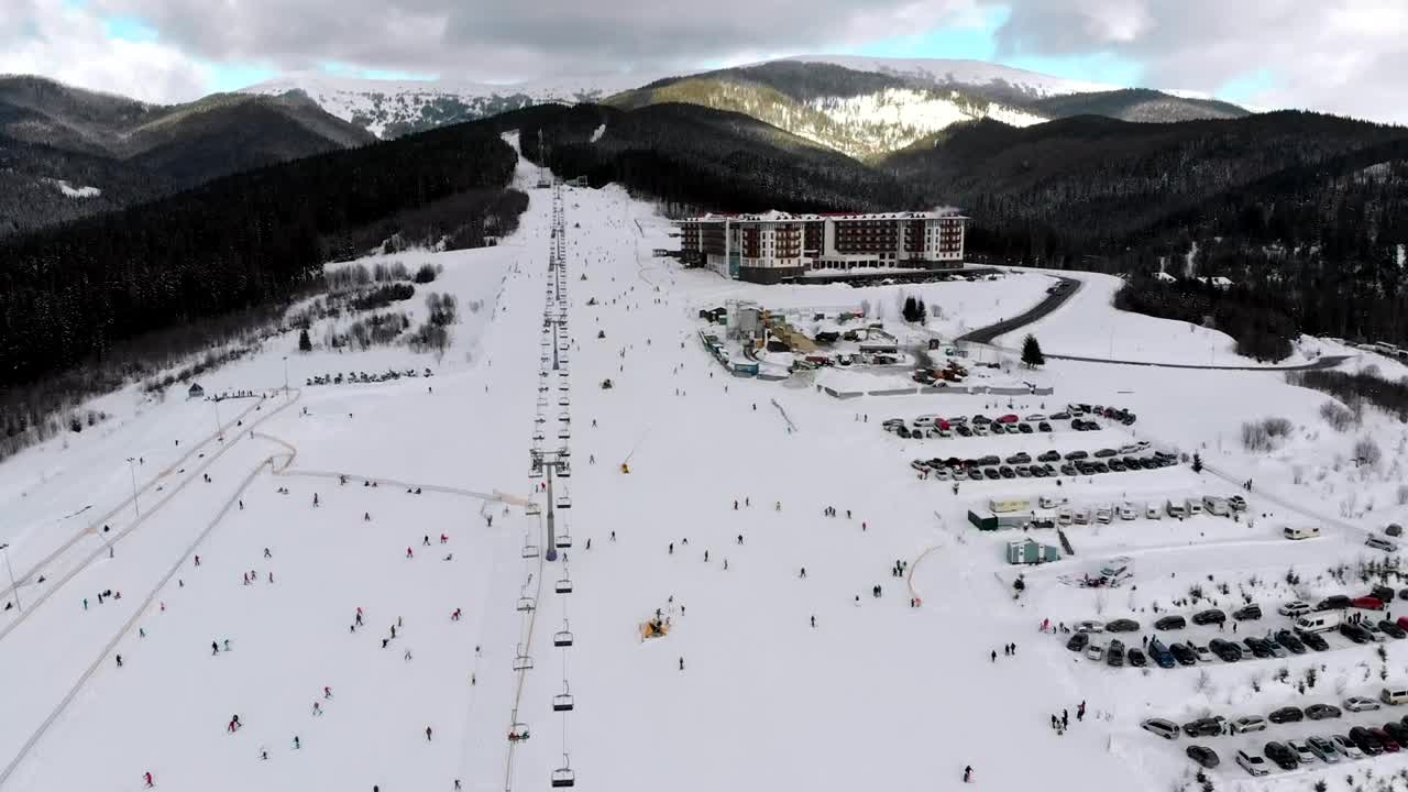 Free Video Stock Ski Resort And Skiers Going Down The Mountain Live Wallpaper - Free Download