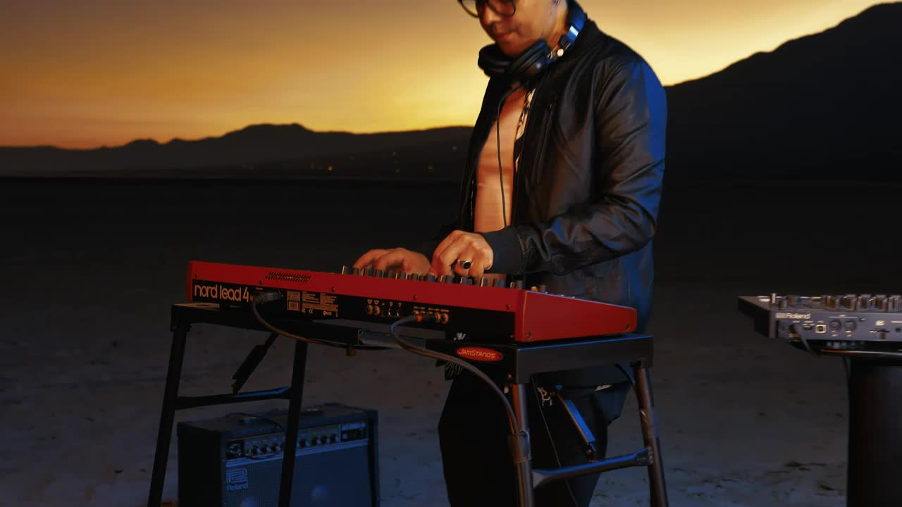 Free Video Stock Skilled Dj Playing With His Equipment In A Huge Desert Live Wallpaper - Free Download