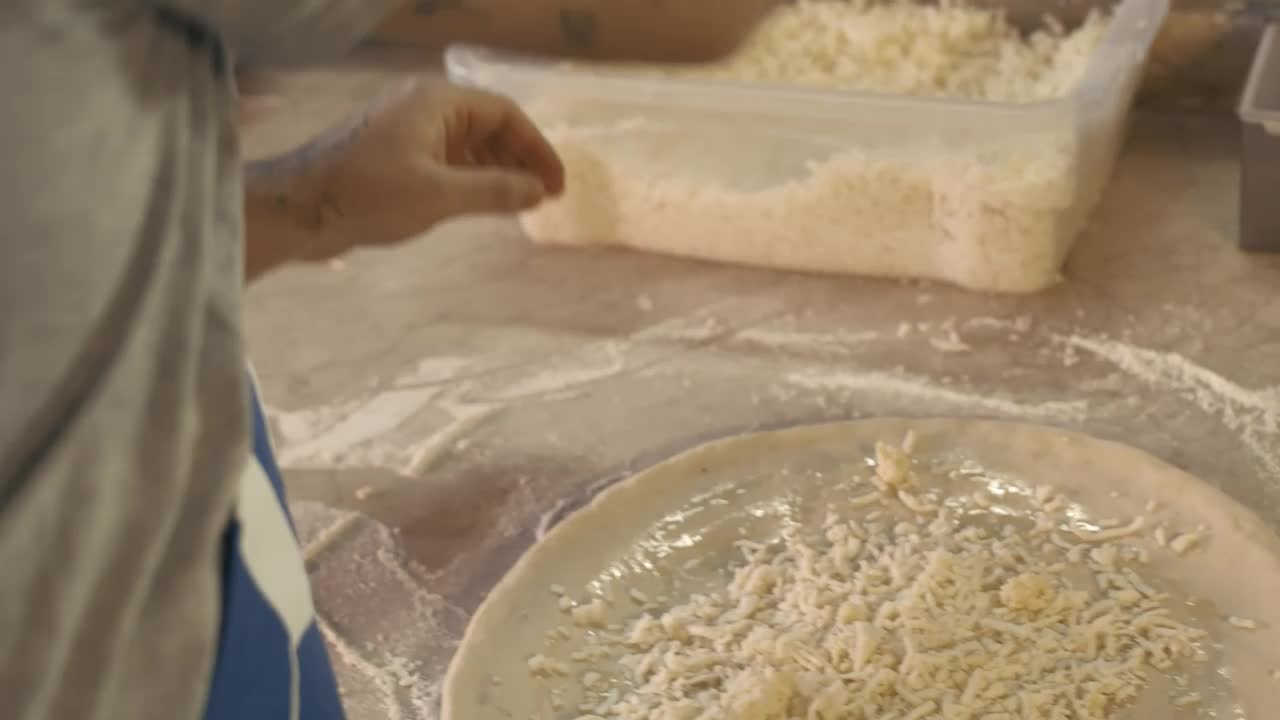 Video Stock Chef Tossing Grated Cheese On A Pizza Live Wallpaper For PC - Free Download